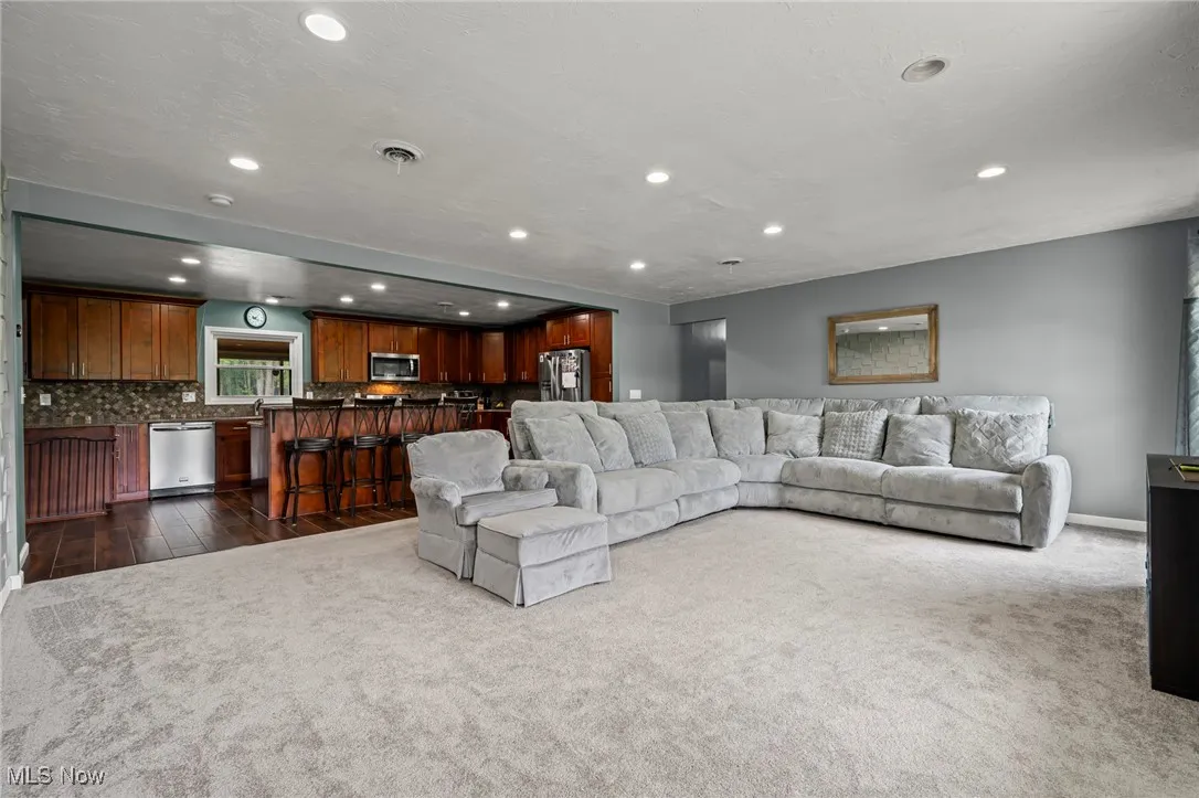 Living room featuring recessed lighting and carpet