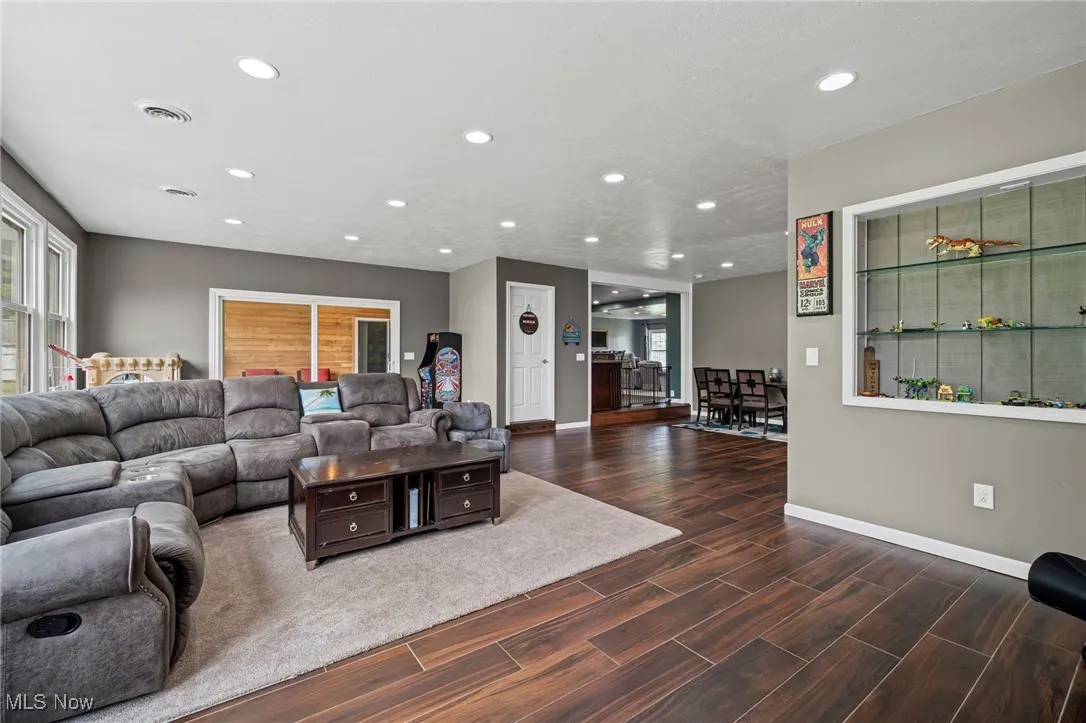 Family room with recessed lighting and wood finished floors