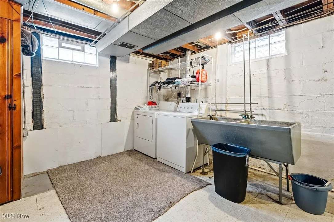 Here is the Laundry Room area in the Basement with glass block windows. Washer & Dryer included. There is a healthy amount of natural light flowing into the space
