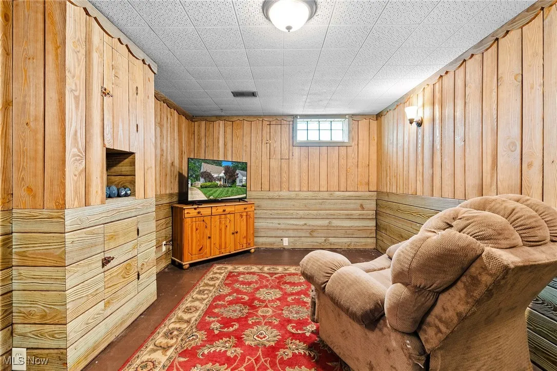 Here is the other side of the basement recreation room that the seller is using to relax and watch TV