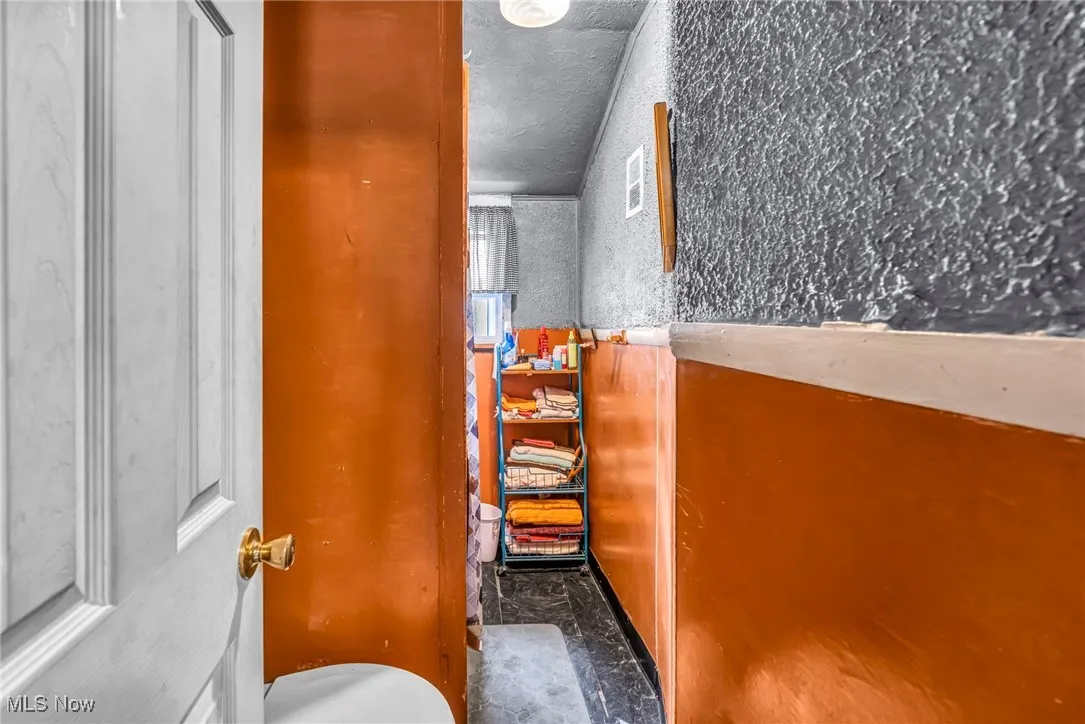 Bathroom with marble finish floors
