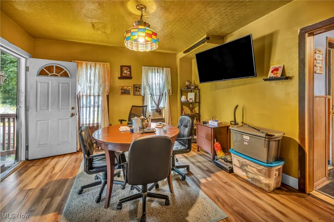 Dining space featuring wood finished floors