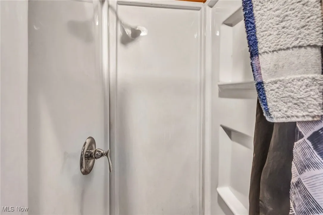 Full bathroom with a stall shower