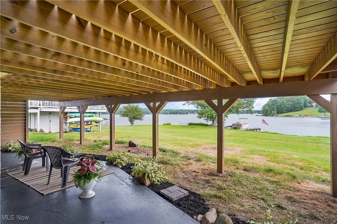 View of patio with a water view