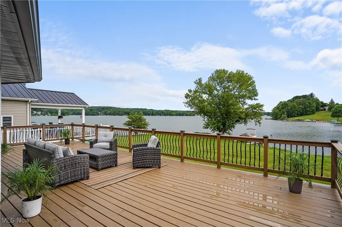 Deck featuring a water view and an outdoor hangout area