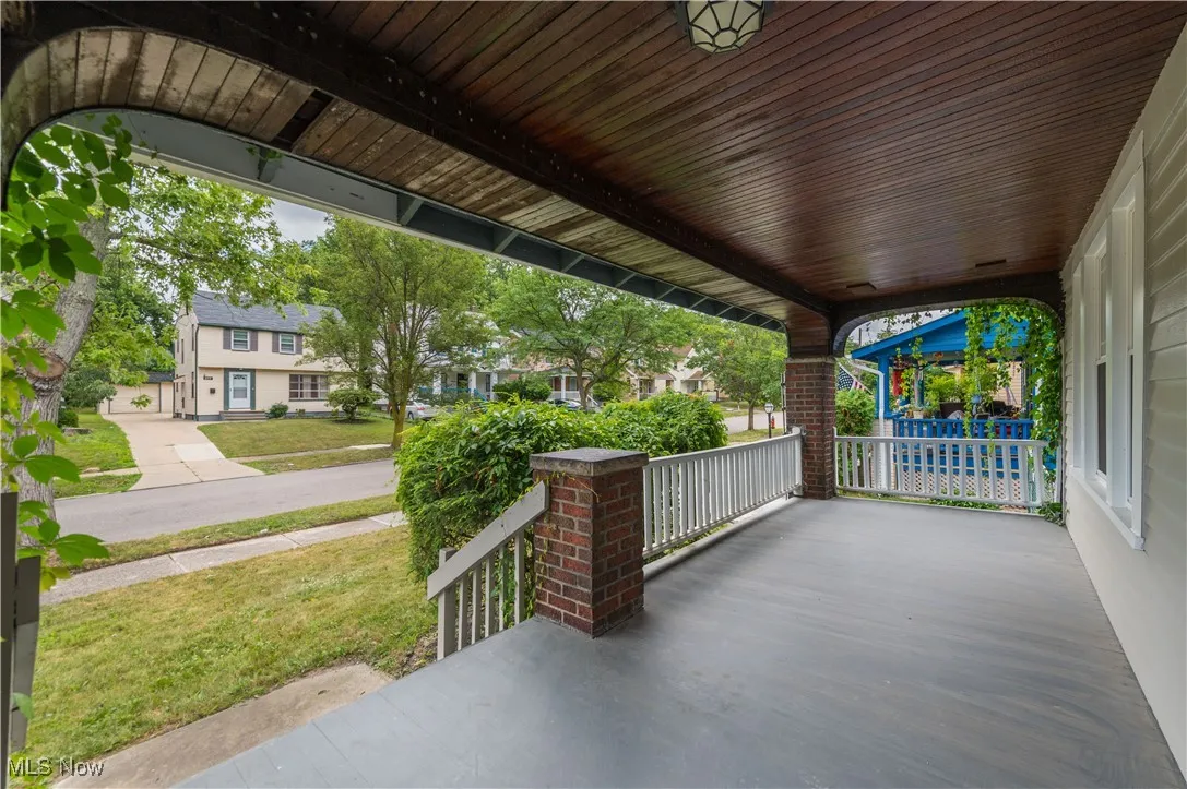 Covered porch with a residential view