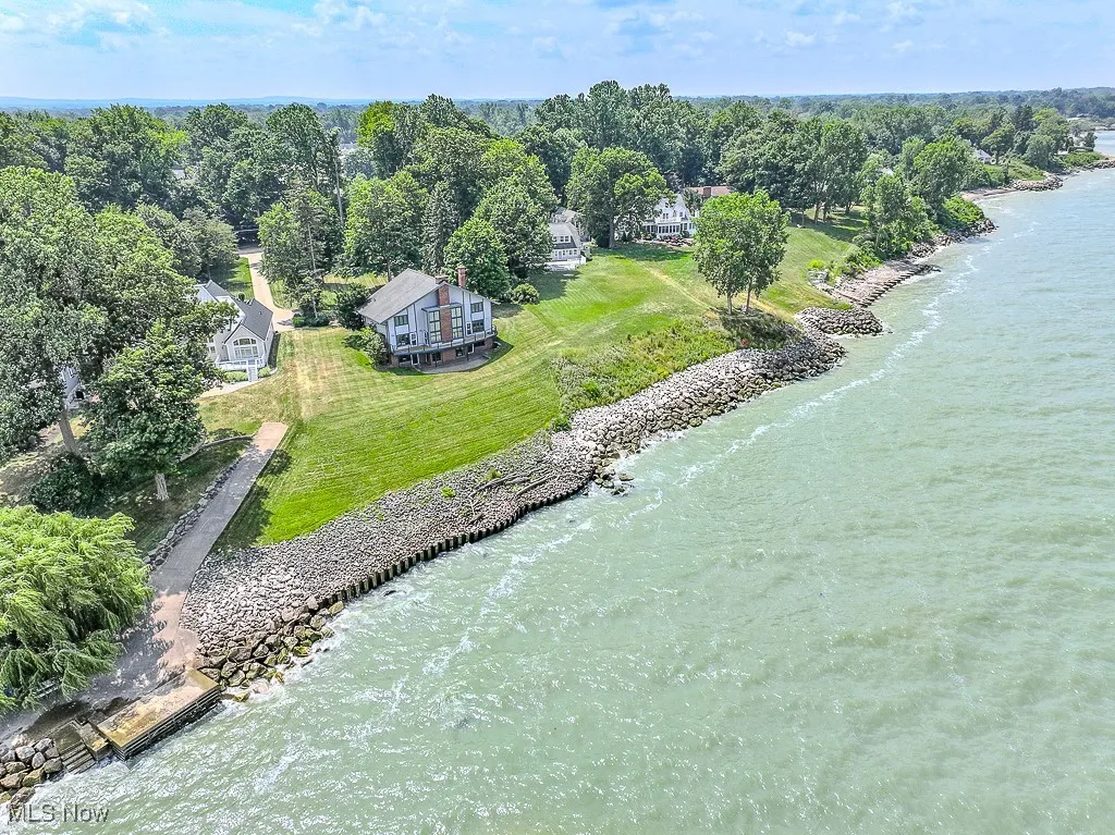 View of subject property with a large body of water