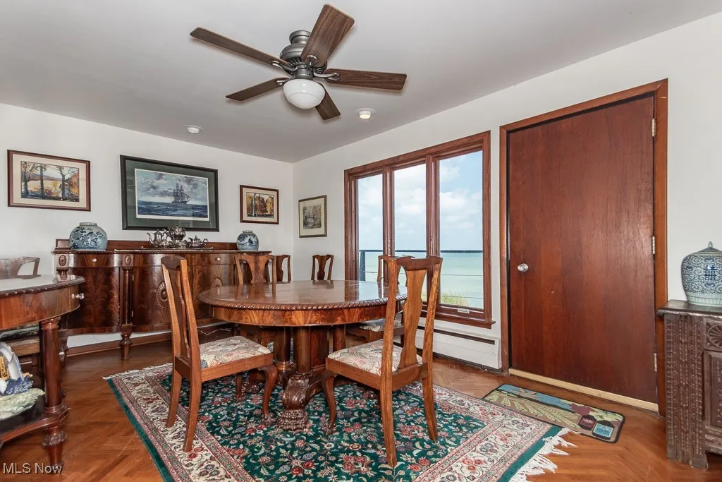 Dining space featuring a ceiling fan and a baseboard radiator
