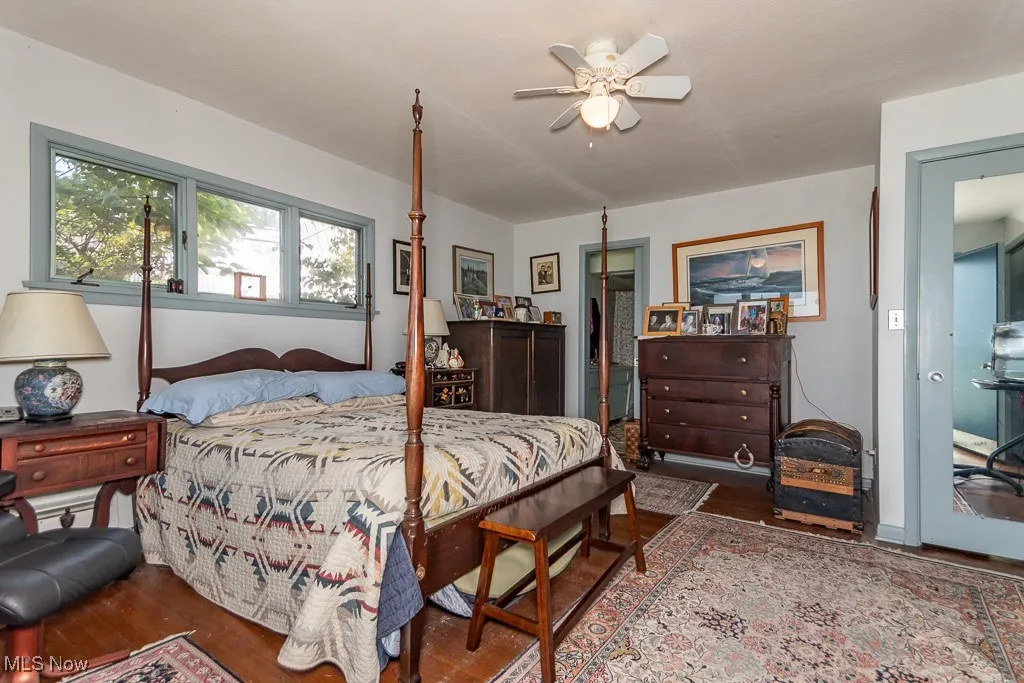 Bedroom with wood finished floors and a ceiling fan