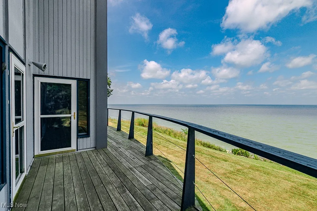 Wooden deck featuring a water view