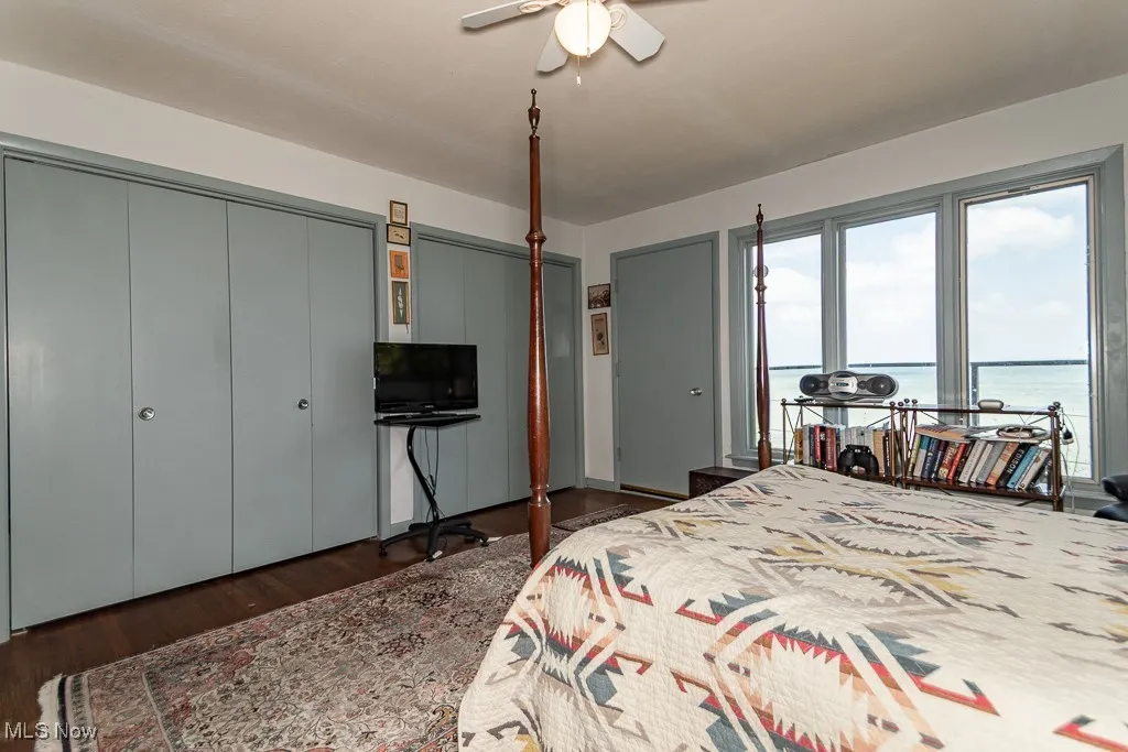 Bedroom with wood finished floors and a ceiling fan
