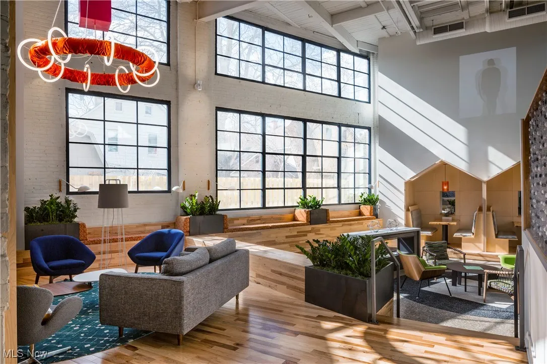 Community living and working area featuring large windows and comfortable seating
