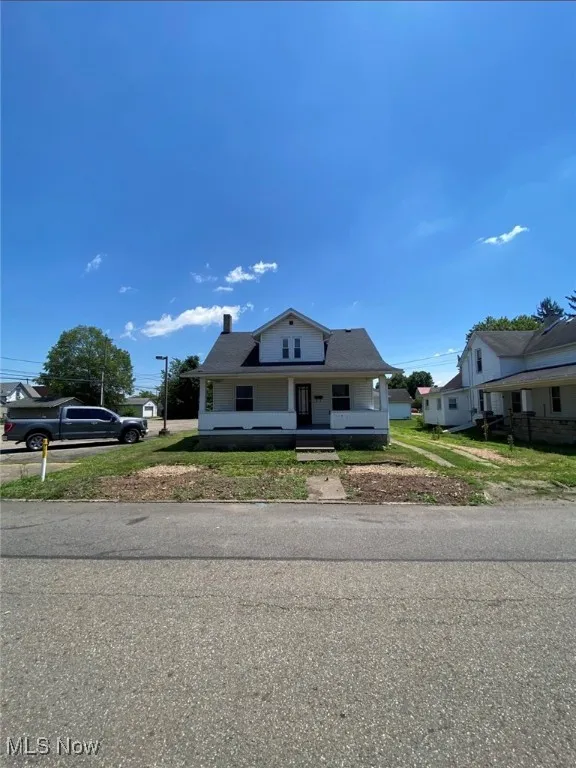 Bungalow-style house with a porch