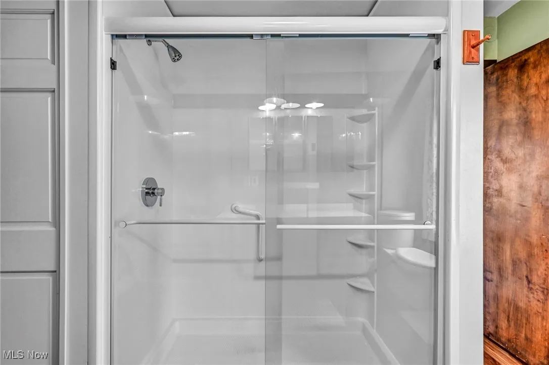 Bathroom featuring a shower stall