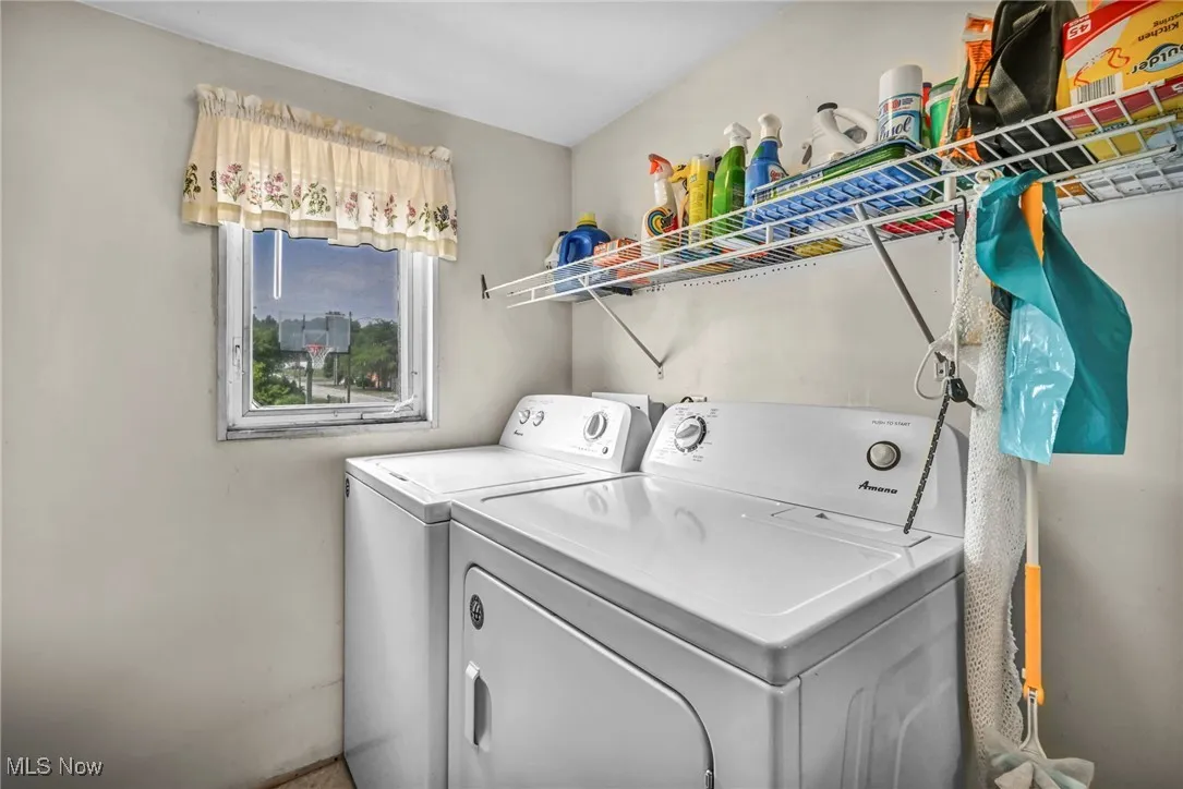 Laundry room featuring separate washer and dryer