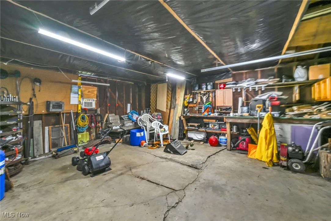 Garage featuring a workshop area