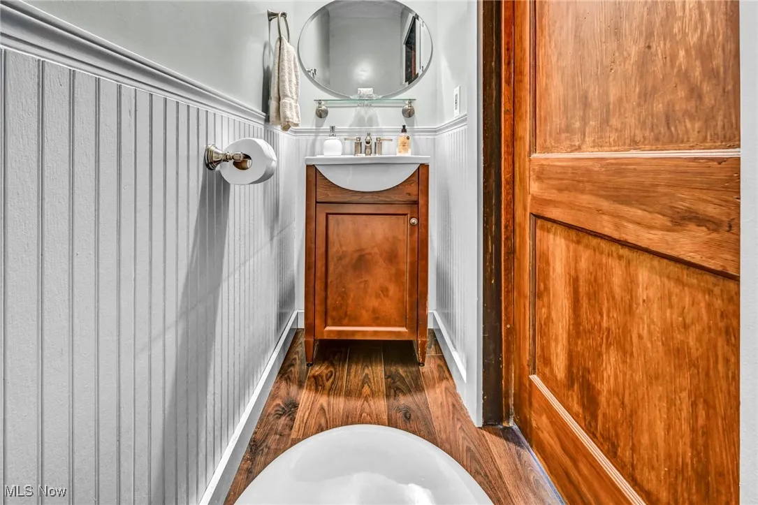 Bathroom with vanity and wood finished floors