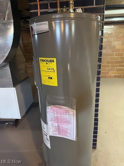 Utility room featuring electric water heater