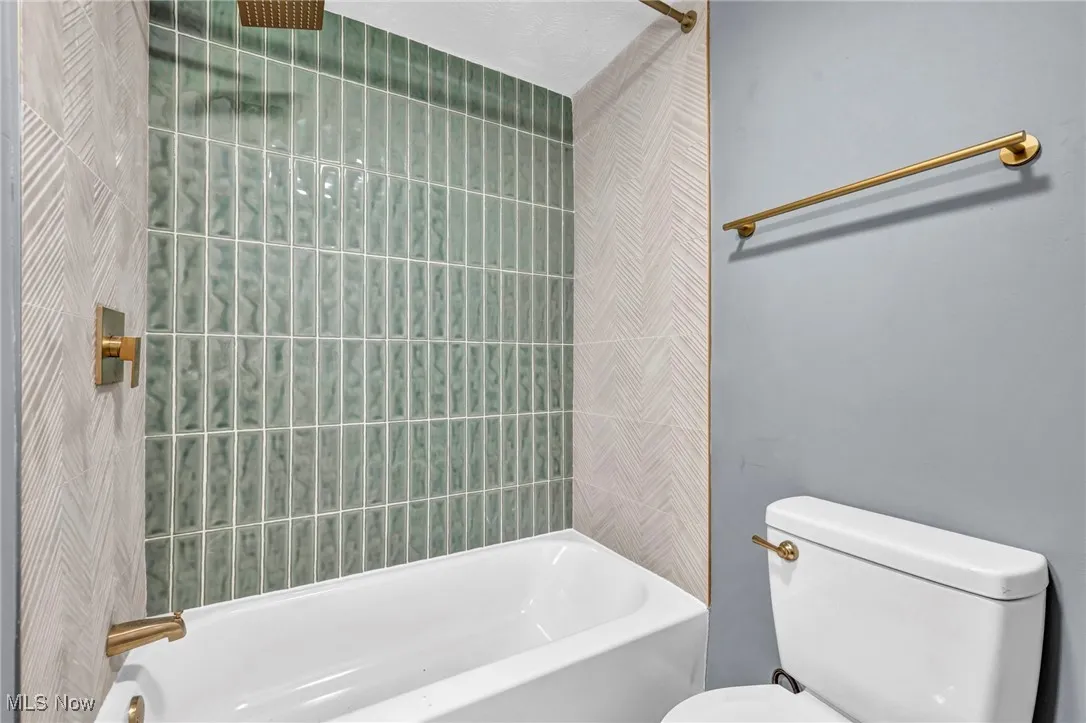 Bathroom with toilet and  shower combination
