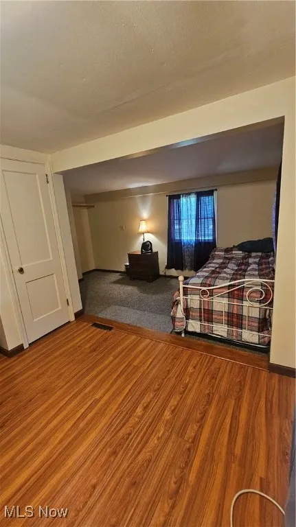 Bedroom with wood finished floors