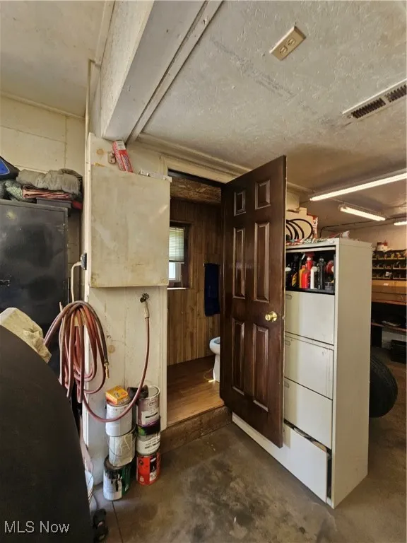 Below grade area featuring wooden walls