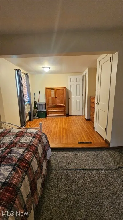 Bedroom with wood finished floors