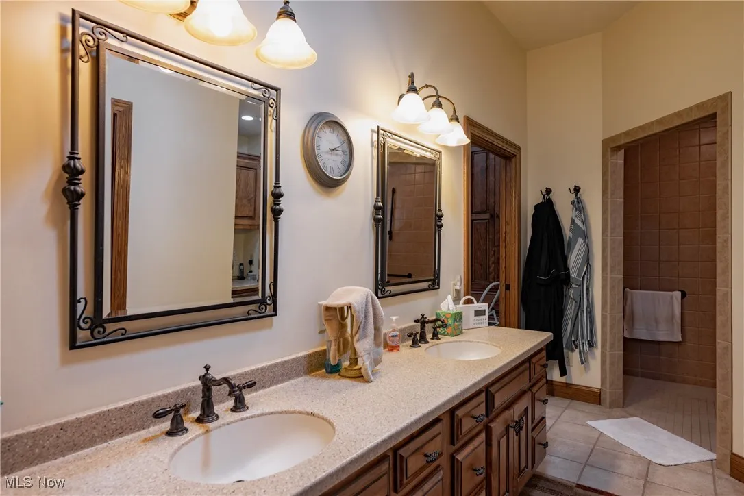 Master bath measures 10x16 with solid surface counters, double sink and ceramic floors.