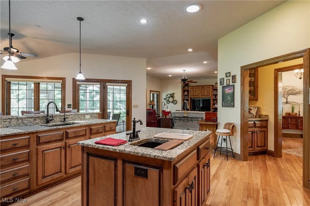 The center island offers a cooks prep sink.