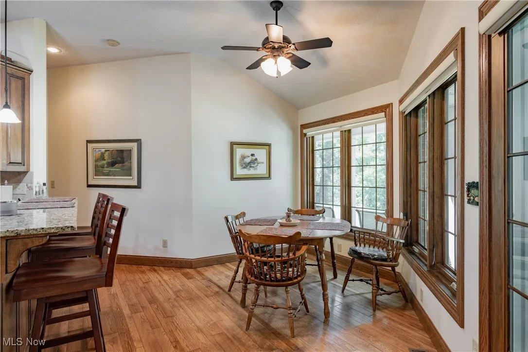 In the other end of the kitchen, you'll enjoy informal dining with views of the golf course. There is also bar height counter dining with barstools.