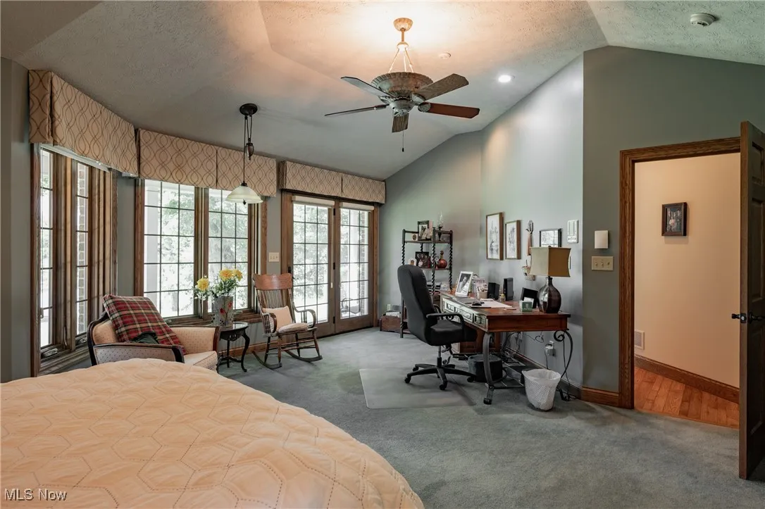 Plenty of space for a desk or seating area. Patio doors access the screened porch.