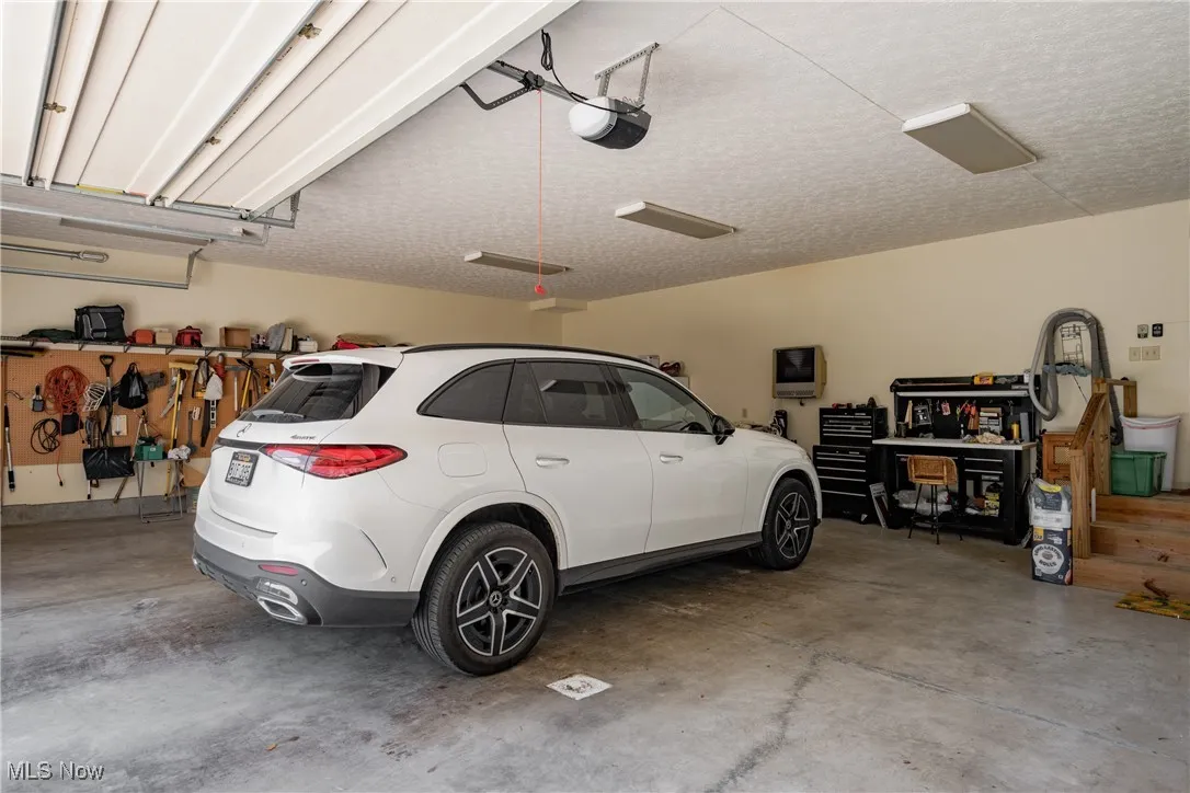 The 3 car Garage measures 28 1/2 ft deep by 33 1/2 ft wide. Entrance to the in-law suite is off to the back corner.