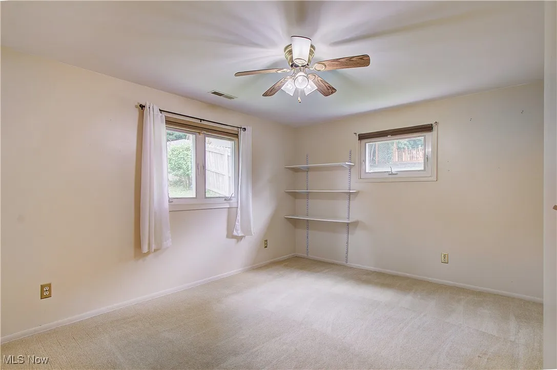Bedroom 1 with comfort adding ceiling fan.