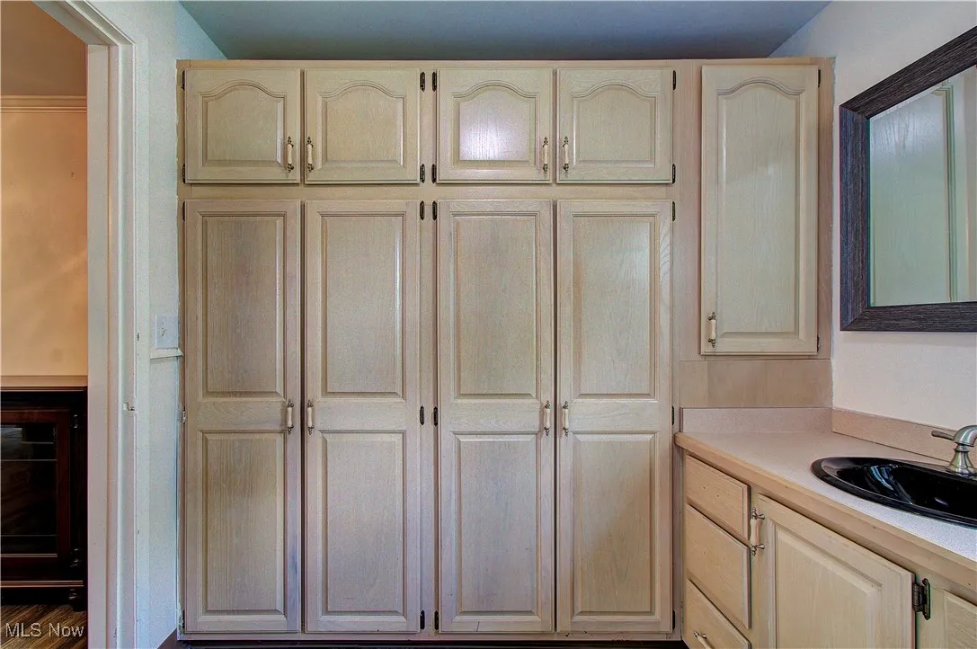 Storage space and closet in the first floor laundry room/half bath.