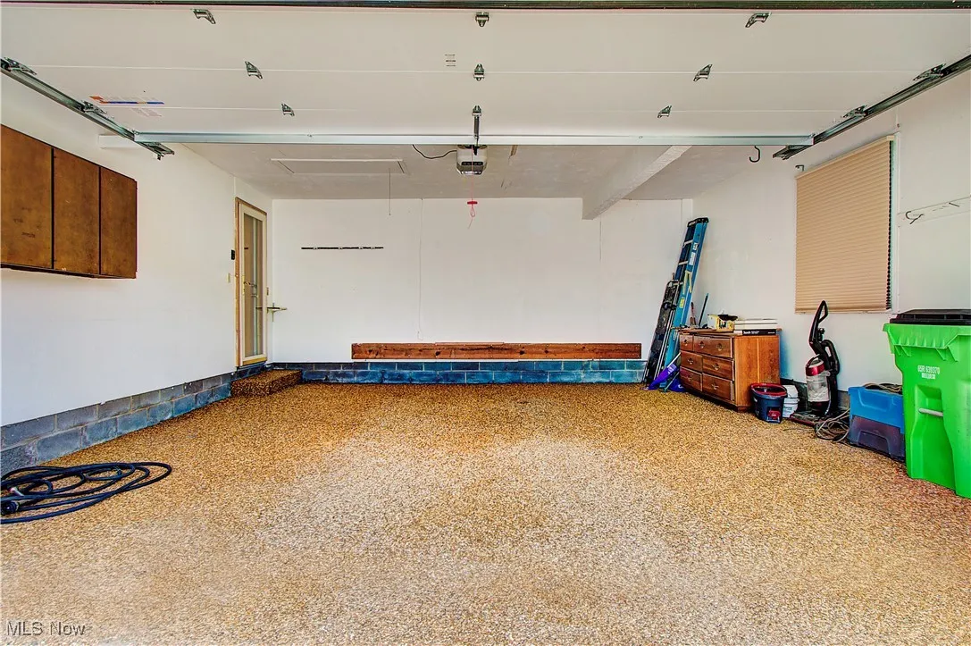 2 car attached garage with Nature Stone floor and both hot and cold water.