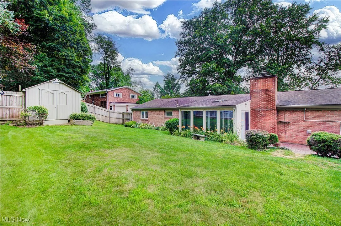 What an adorable backyard!! Storage shed to the left.
