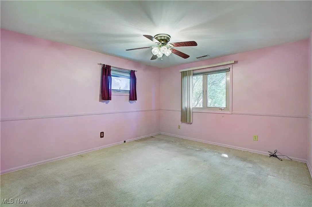 Bedroom 2 with comfort adding ceiling fan.