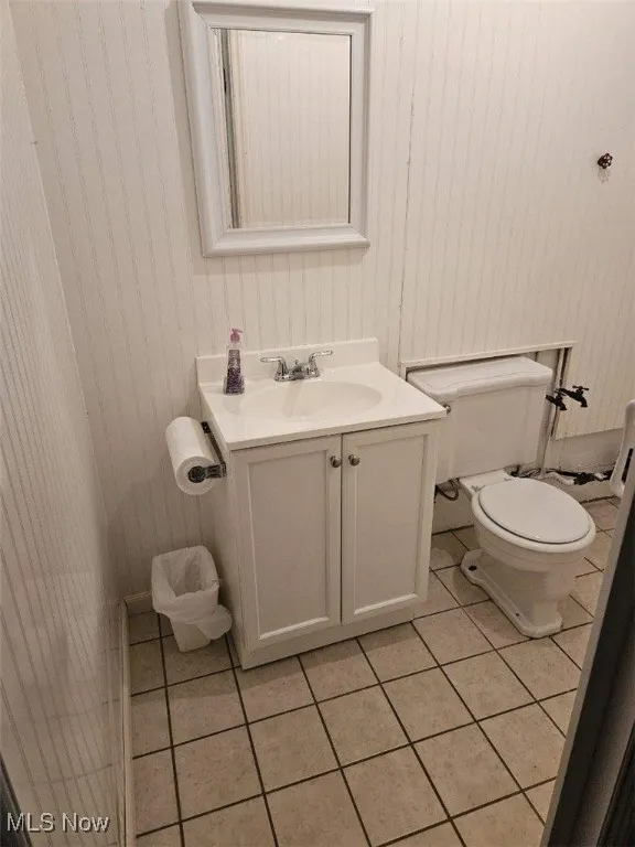 Bathroom featuring tile patterned floors and vanity