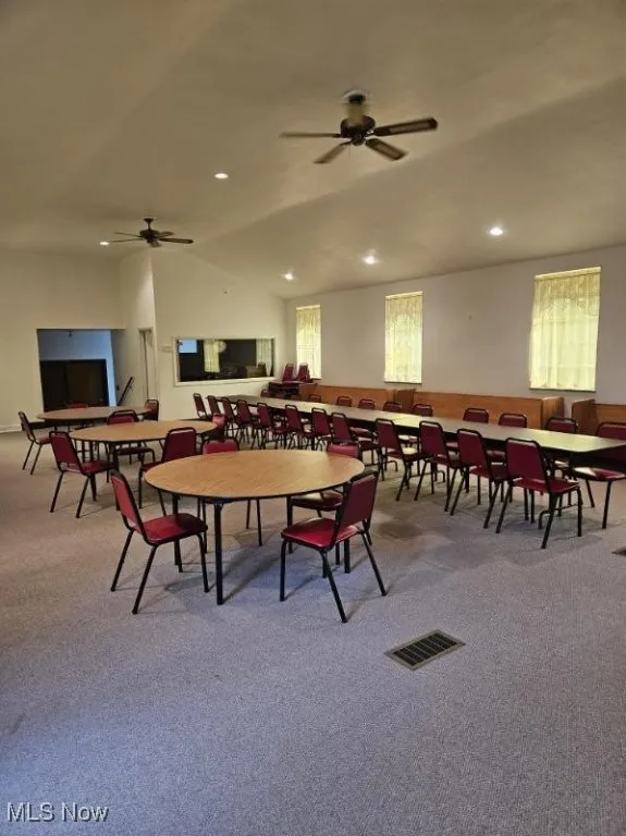 Dining area with carpet, healthy amount of natural light, recessed lighting, and a ceiling fan