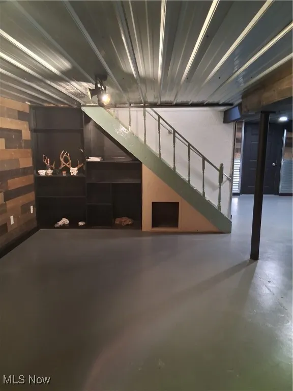 Garage featuring wood walls