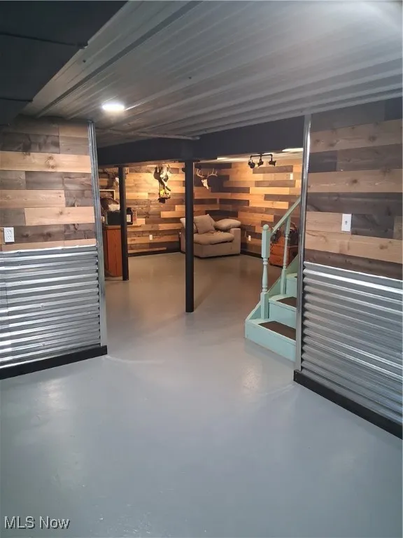 Finished below grade area with wood walls and stairs