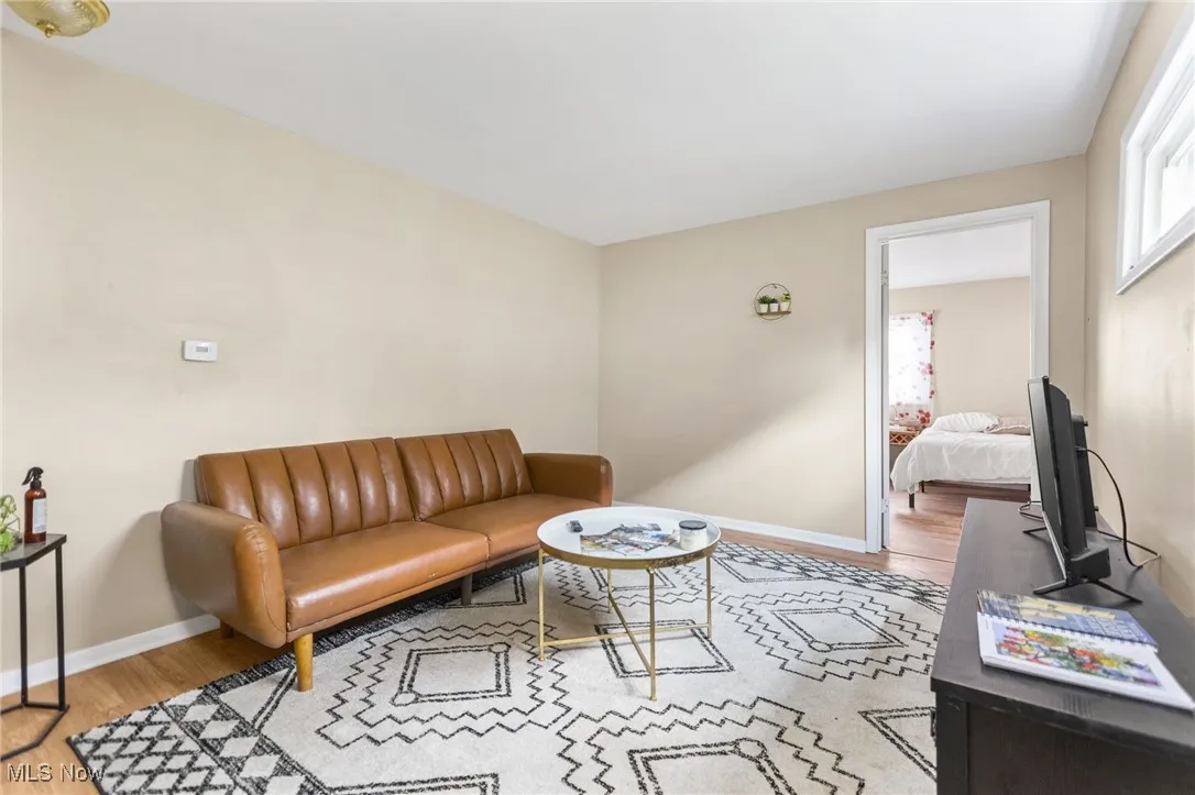 Living room featuring wood finished floors and baseboards
