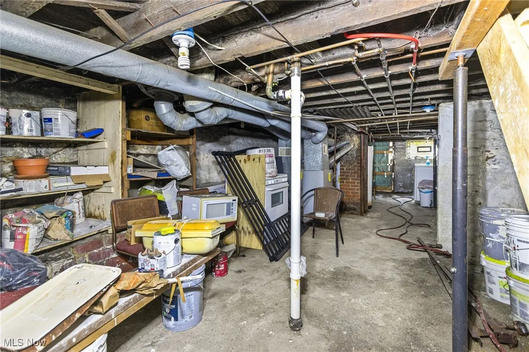 Unfinished basement with washer / clothes dryer