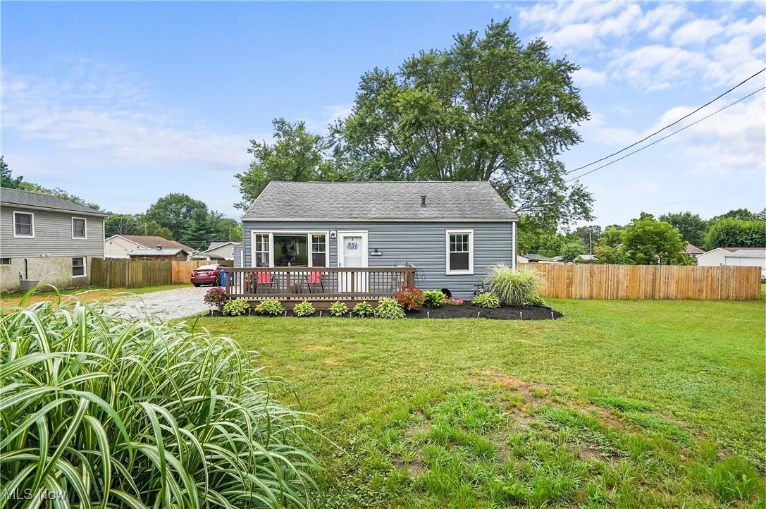 Back of property with a wooden deck