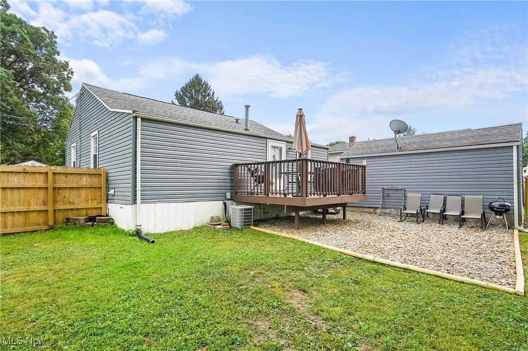 Rear view of house with a wooden deck