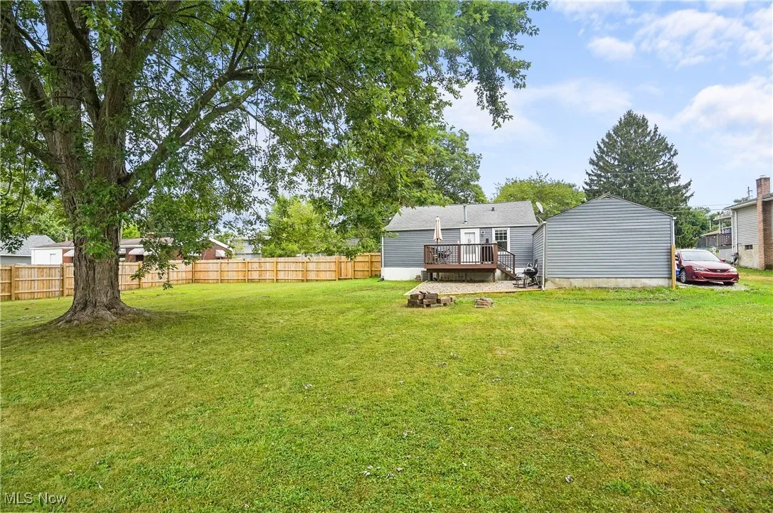 View of yard with a wooden deck