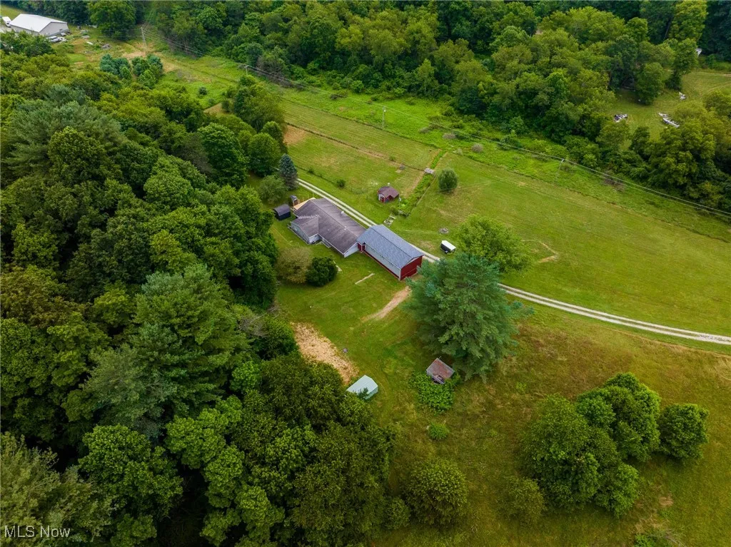 Aerial view of property and surrounding area with rural landscape