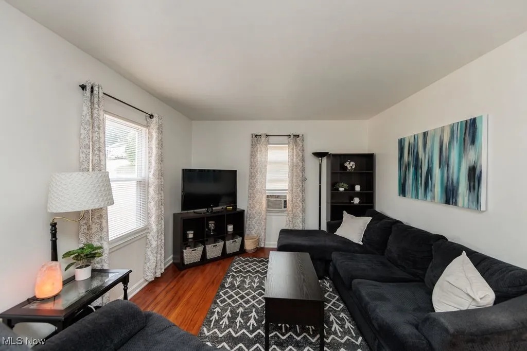 Living room with wood finished floors and baseboards