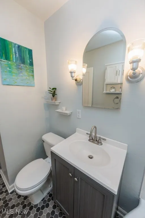 Bathroom featuring vanity and toilet