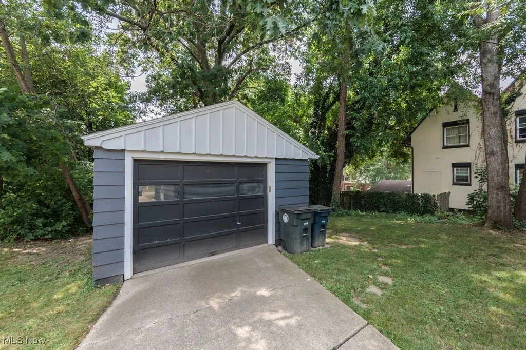 Detached garage with concrete driveway
