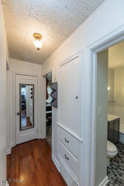 Hall featuring wood finished floors